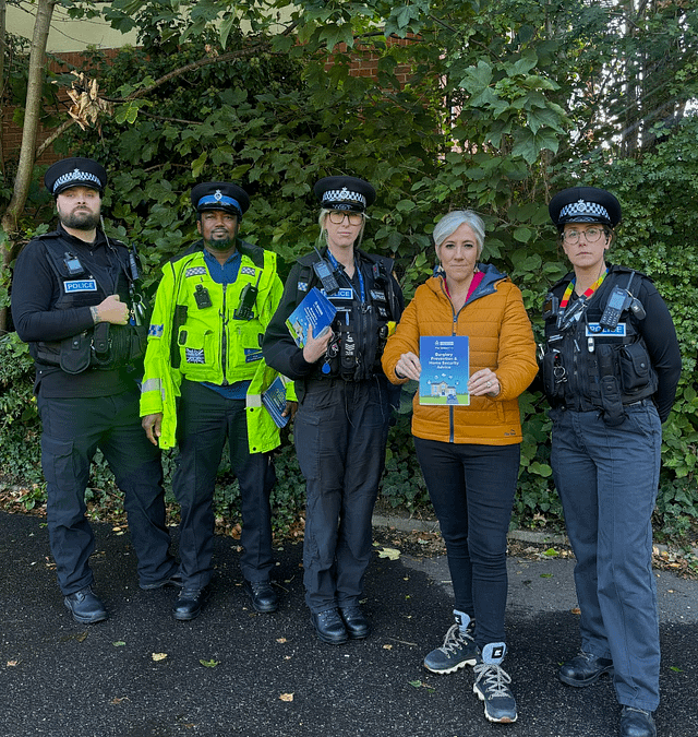 Daisy is standing with a group of officers from Hertfordshire Constabulary, ahead of a patrol to discuss burglaries and car thefts with local residents.